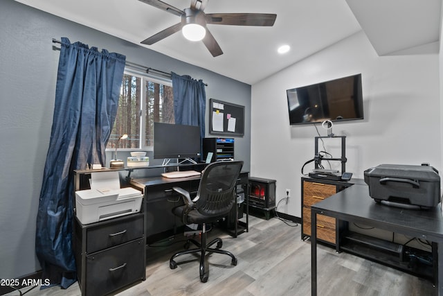 office space featuring wood finished floors, baseboards, recessed lighting, ceiling fan, and vaulted ceiling