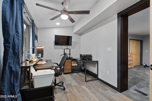 office with a ceiling fan, wood finished floors, baseboards, and visible vents