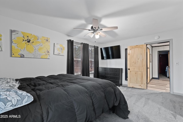 bedroom featuring a ceiling fan, baseboards, and carpet floors