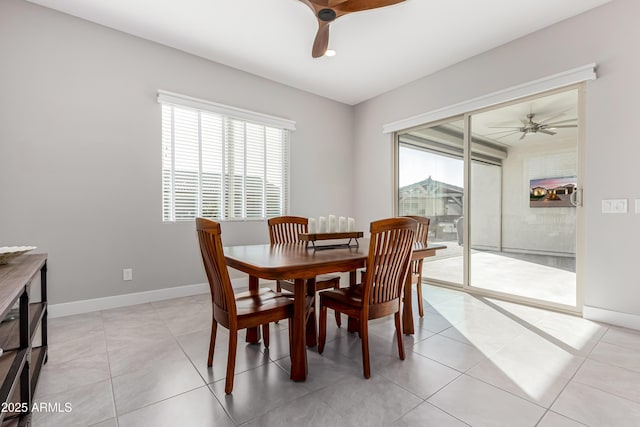 dining room with light tile patterned flooring, ceiling fan, and a wealth of natural light