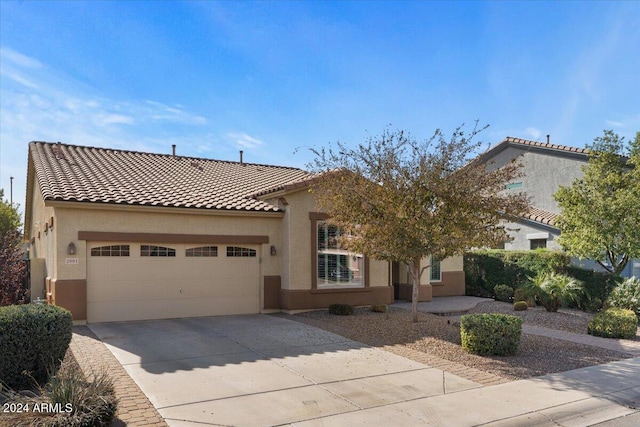 mediterranean / spanish-style home featuring a garage