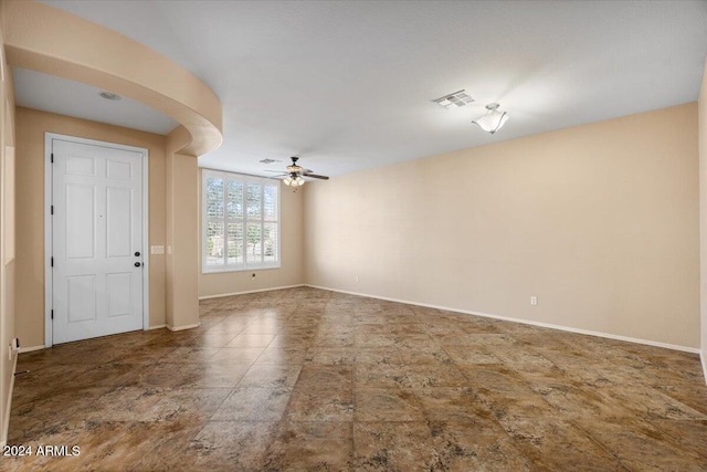 unfurnished room featuring ceiling fan