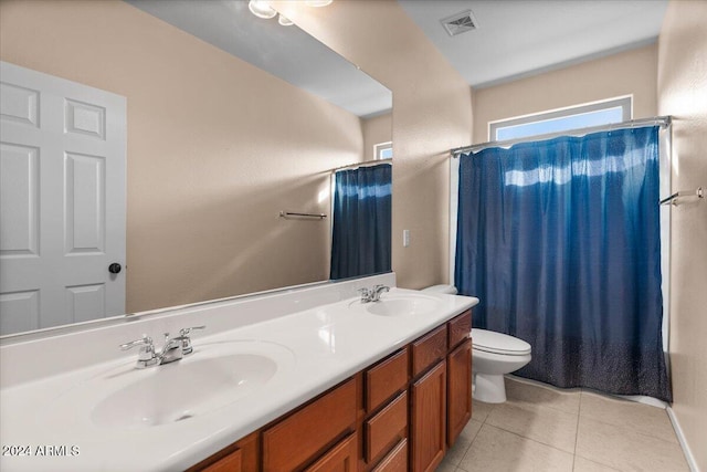 full bathroom with toilet, shower / bath combo, vanity, and tile patterned floors