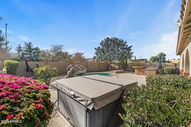 view of patio / terrace featuring a hot tub