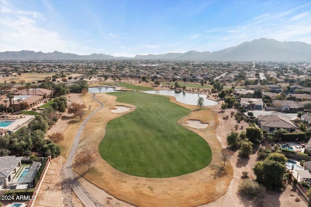 birds eye view of property featuring a water and mountain view