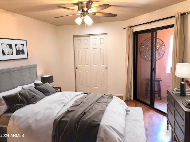 bedroom featuring hardwood / wood-style floors, ceiling fan, and access to outside