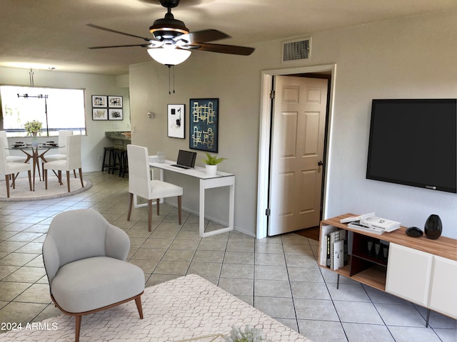 living room with ceiling fan and light tile patterned floors