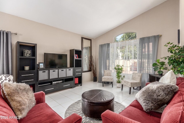 living room with light tile patterned flooring and vaulted ceiling