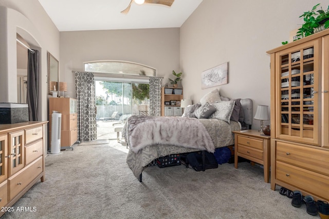 carpeted bedroom featuring lofted ceiling, access to outside, and ceiling fan