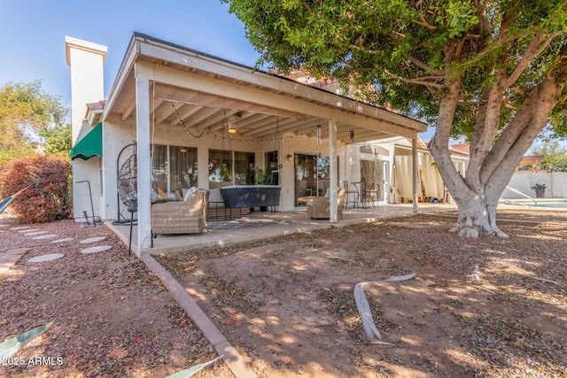 rear view of property featuring a patio