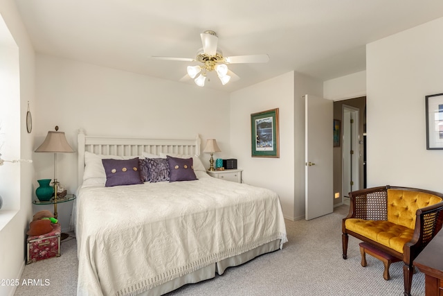 bedroom with ceiling fan and light colored carpet