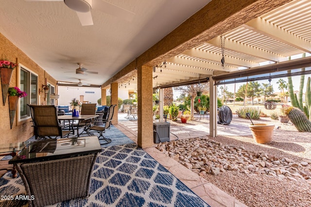 view of patio featuring ceiling fan and a pergola