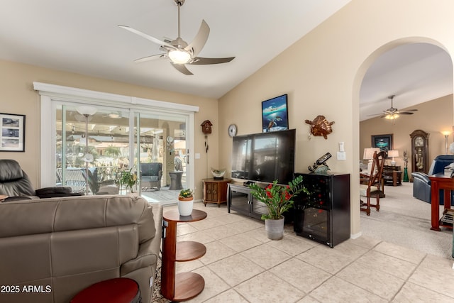 tiled living room featuring vaulted ceiling and ceiling fan