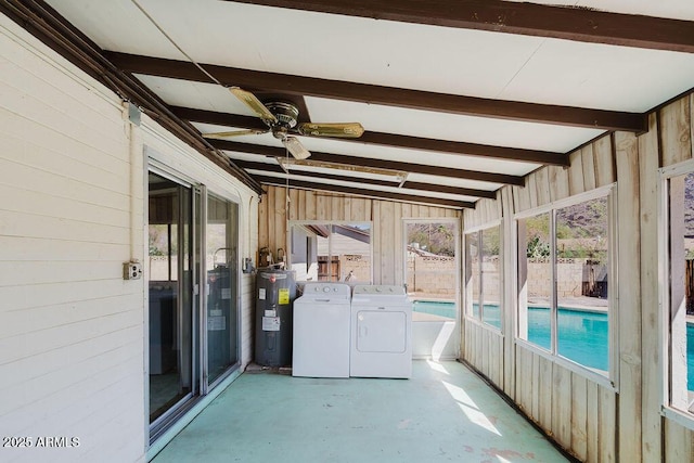 unfurnished sunroom featuring beamed ceiling, a ceiling fan, electric water heater, and washer and clothes dryer