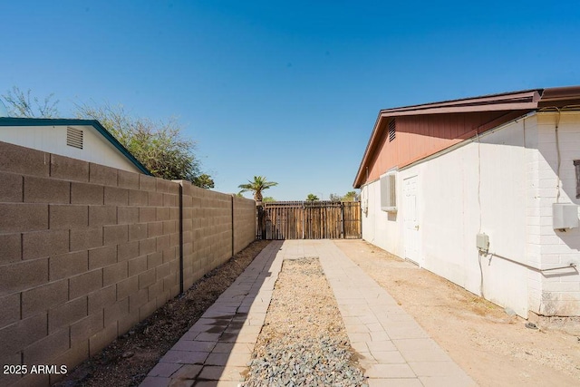 view of side of property featuring a fenced backyard