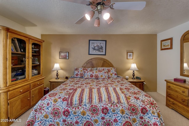 bedroom featuring arched walkways, a textured ceiling, light carpet, and a ceiling fan