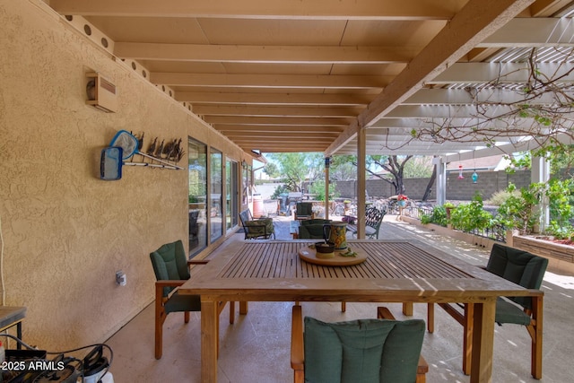 view of patio / terrace featuring outdoor dining area, a pergola, and fence
