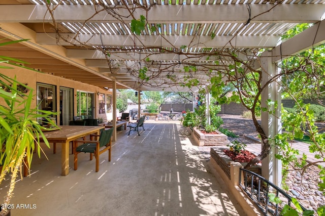 view of patio with fence, a pergola, and outdoor dining space