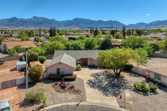 birds eye view of property with a mountain view