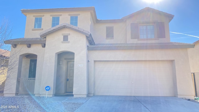 7425 W Crown King Rd, Phoenix, AZ 85043 - view of front of home with a garage, driveway, and stucco siding