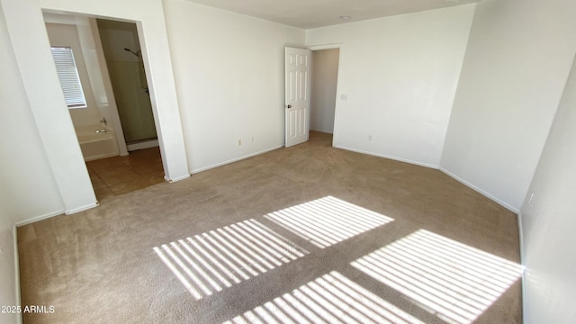7425 W Crown King Rd, Phoenix, AZ 85043 - unfurnished bedroom featuring ensuite bathroom, baseboards, carpet floors, and a baseboard radiator