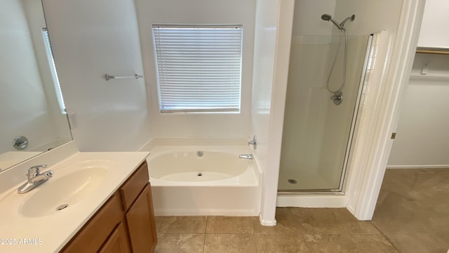7425 W Crown King Rd, Phoenix, AZ 85043 - full bathroom featuring a shower stall, a garden tub, tile patterned flooring, and vanity