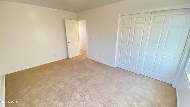 7425 W Crown King Rd, Phoenix, AZ 85043 - unfurnished bedroom featuring carpet floors, a closet, and baseboards