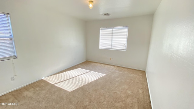 7425 W Crown King Rd, Phoenix, AZ 85043 - unfurnished room with light carpet, visible vents, and baseboards