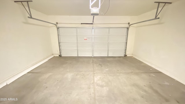 7425 W Crown King Rd, Phoenix, AZ 85043 - garage with a garage door opener and baseboards