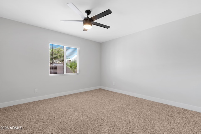 3607 N 79th Ave, Phoenix, AZ 85033 - carpeted spare room with baseboards and a ceiling fan