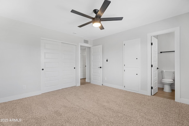 3607 N 79th Ave, Phoenix, AZ 85033 - unfurnished bedroom with carpet flooring, ensuite bathroom, baseboards, and a ceiling fan