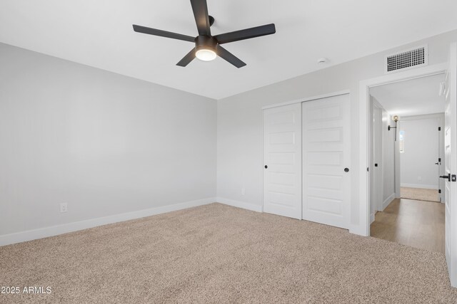 3607 N 79th Ave, Phoenix, AZ 85033 - unfurnished bedroom featuring a closet, carpet, baseboards, and a ceiling fan