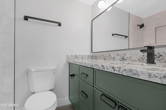 3607 N 79th Ave, Phoenix, AZ 85033 - full bathroom with toilet, vanity, tiled shower, and baseboards