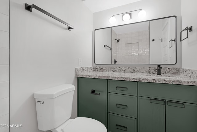 3607 N 79th Ave, Phoenix, AZ 85033 - bathroom featuring toilet, a tile shower, and vanity