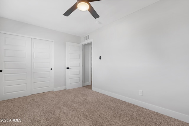 3607 N 79th Ave, Phoenix, AZ 85033 - unfurnished bedroom with carpet floors, baseboards, a closet, and a ceiling fan