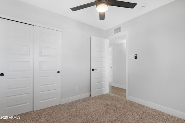 3607 N 79th Ave, Phoenix, AZ 85033 - unfurnished bedroom featuring carpet flooring, baseboards, a closet, and ceiling fan