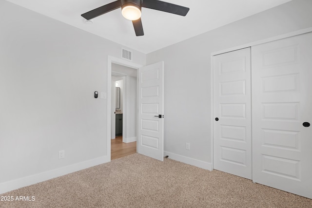 3607 N 79th Ave, Phoenix, AZ 85033 - unfurnished bedroom featuring light carpet, baseboards, a closet, and a ceiling fan