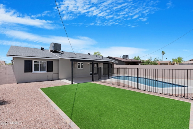 3607 N 79th Ave, Phoenix, AZ 85033 - back of property featuring a patio, a shingled roof, and cooling unit