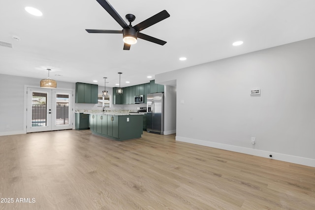 3607 N 79th Ave, Phoenix, AZ 85033 - unfurnished living room with baseboards, french doors, a ceiling fan, light wood finished floors, and recessed lighting