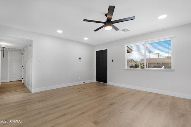 3607 N 79th Ave, Phoenix, AZ 85033 - spare room with baseboards, light wood-type flooring, ceiling fan, and recessed lighting