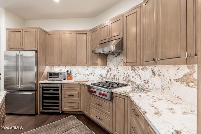 kitchen featuring light brown cabinets, dark hardwood / wood-style floors, appliances with stainless steel finishes, tasteful backsplash, and beverage cooler