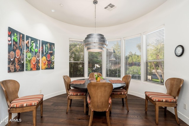 dining room with dark hardwood / wood-style flooring and plenty of natural light