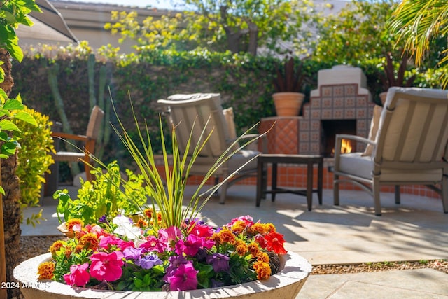 view of patio / terrace featuring exterior fireplace