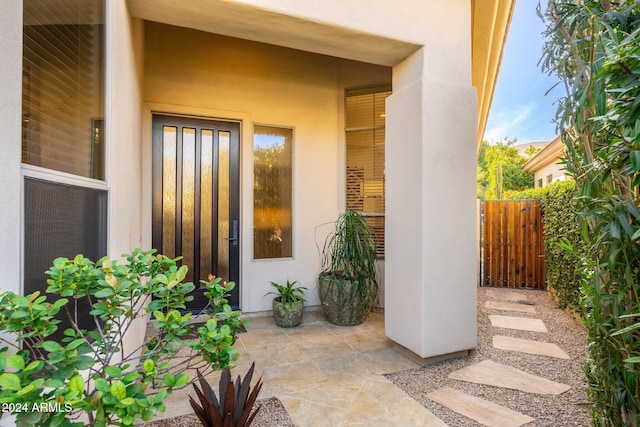 property entrance with a patio area