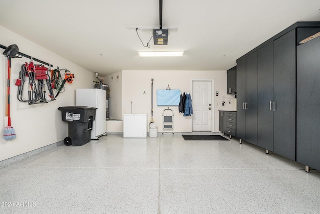 garage with water heater, refrigerator, and a garage door opener