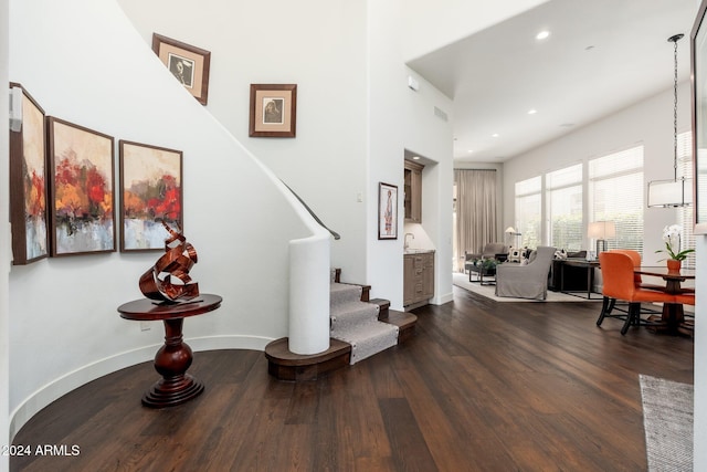 stairs with hardwood / wood-style floors