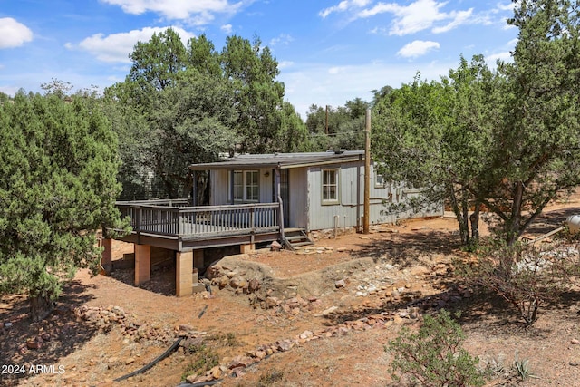 view of front of property with a wooden deck