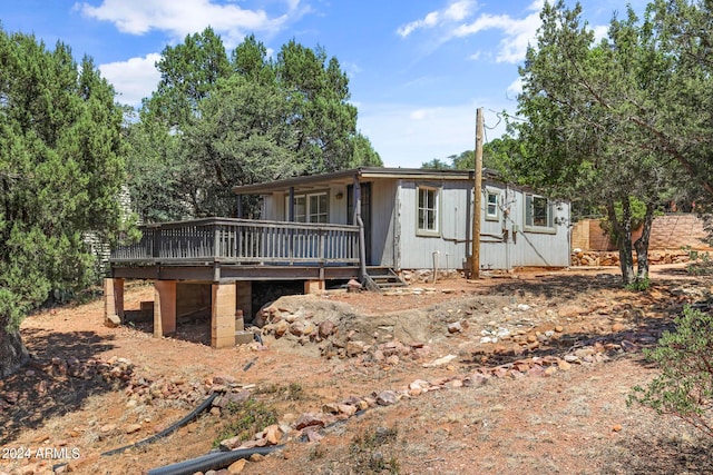 view of front of house featuring a wooden deck