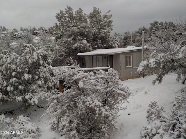 view of snow covered property