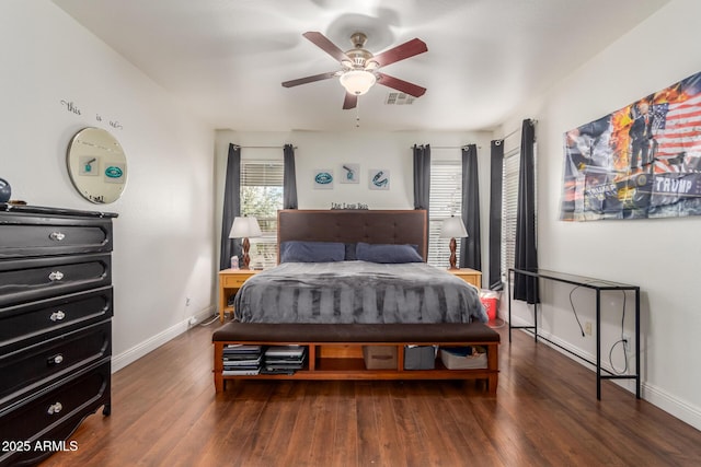 bedroom with dark hardwood / wood-style floors and ceiling fan